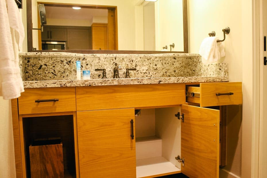 a vanity with cabinets and drawers for storage in the deluxe studio at Copper Creek Villas 