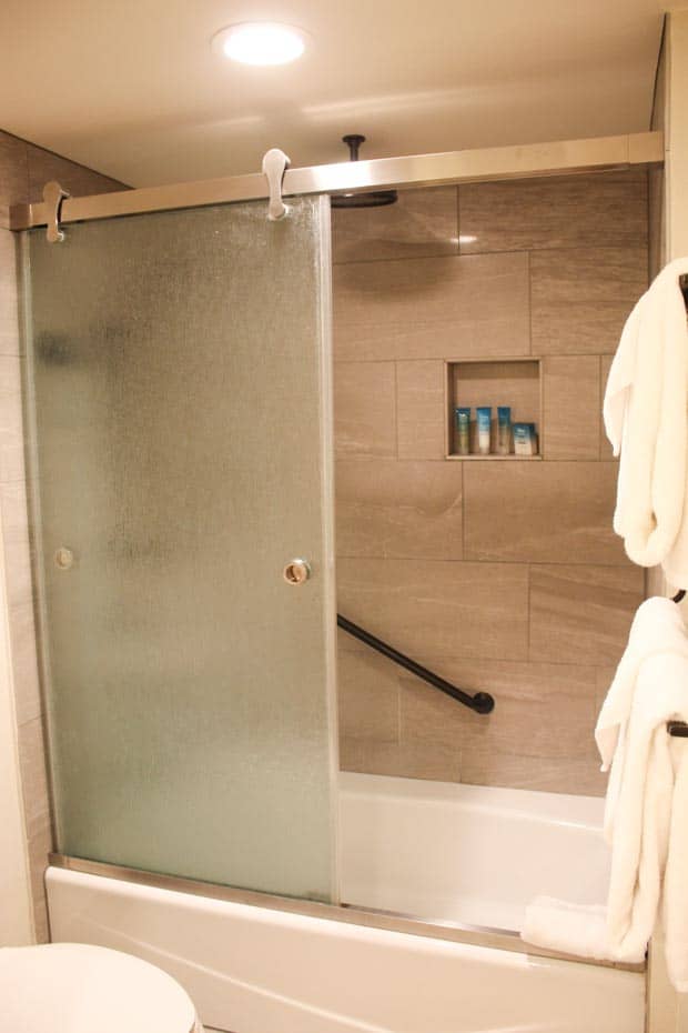 a tub with a shower combination at Copper Creek Villas 