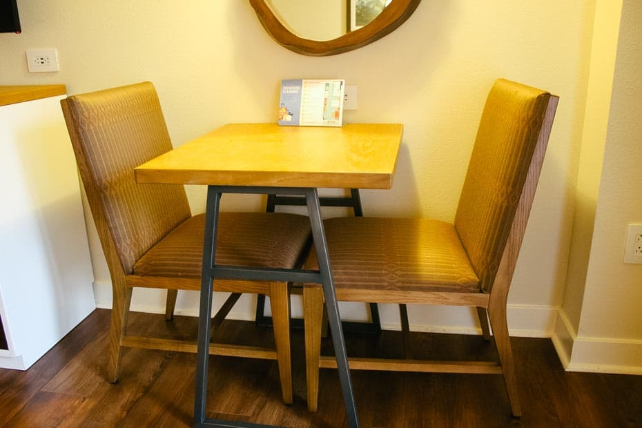 a small table with two chairs 