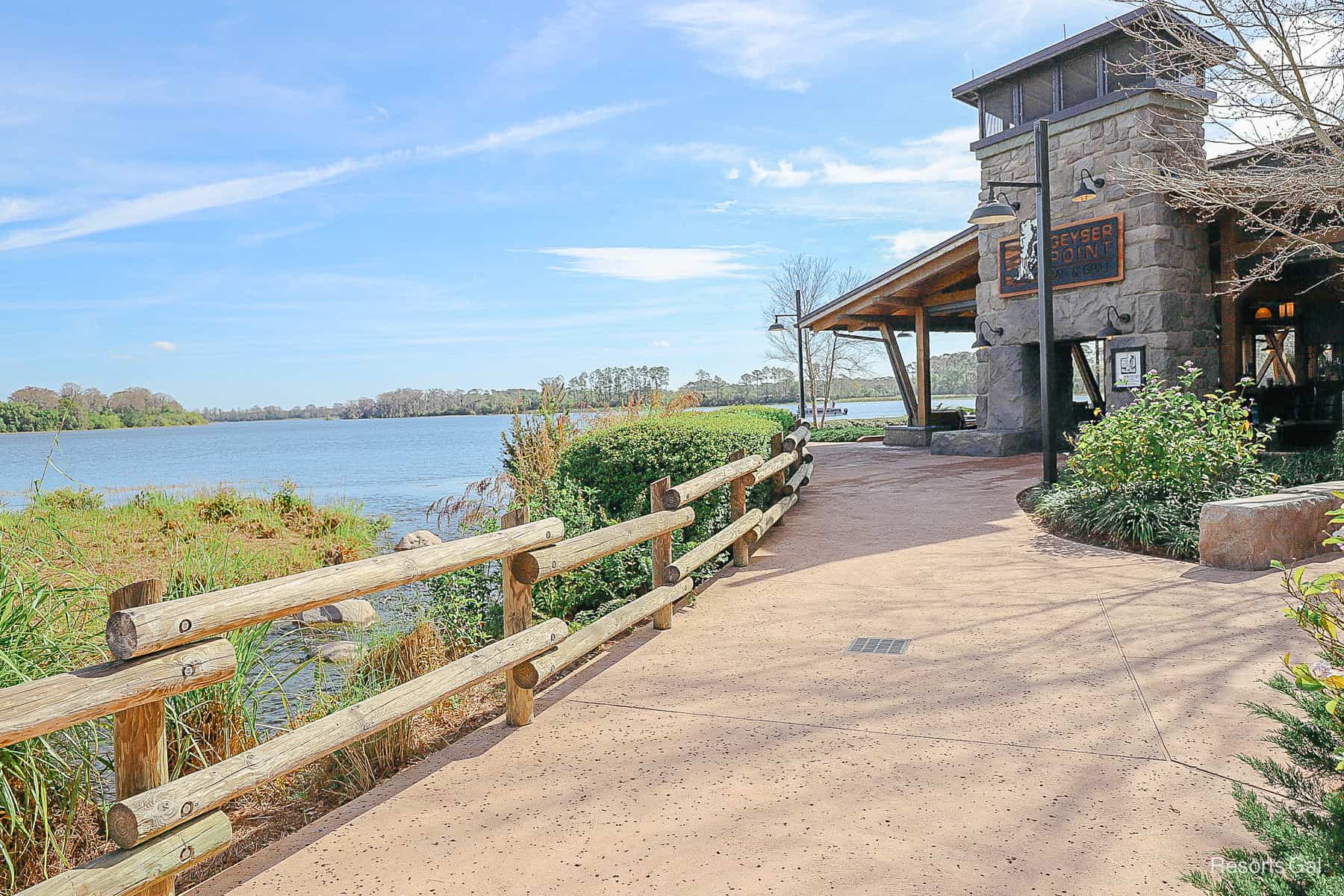 a walkway by Bay Lake at Disney's Wilderness Lodge 