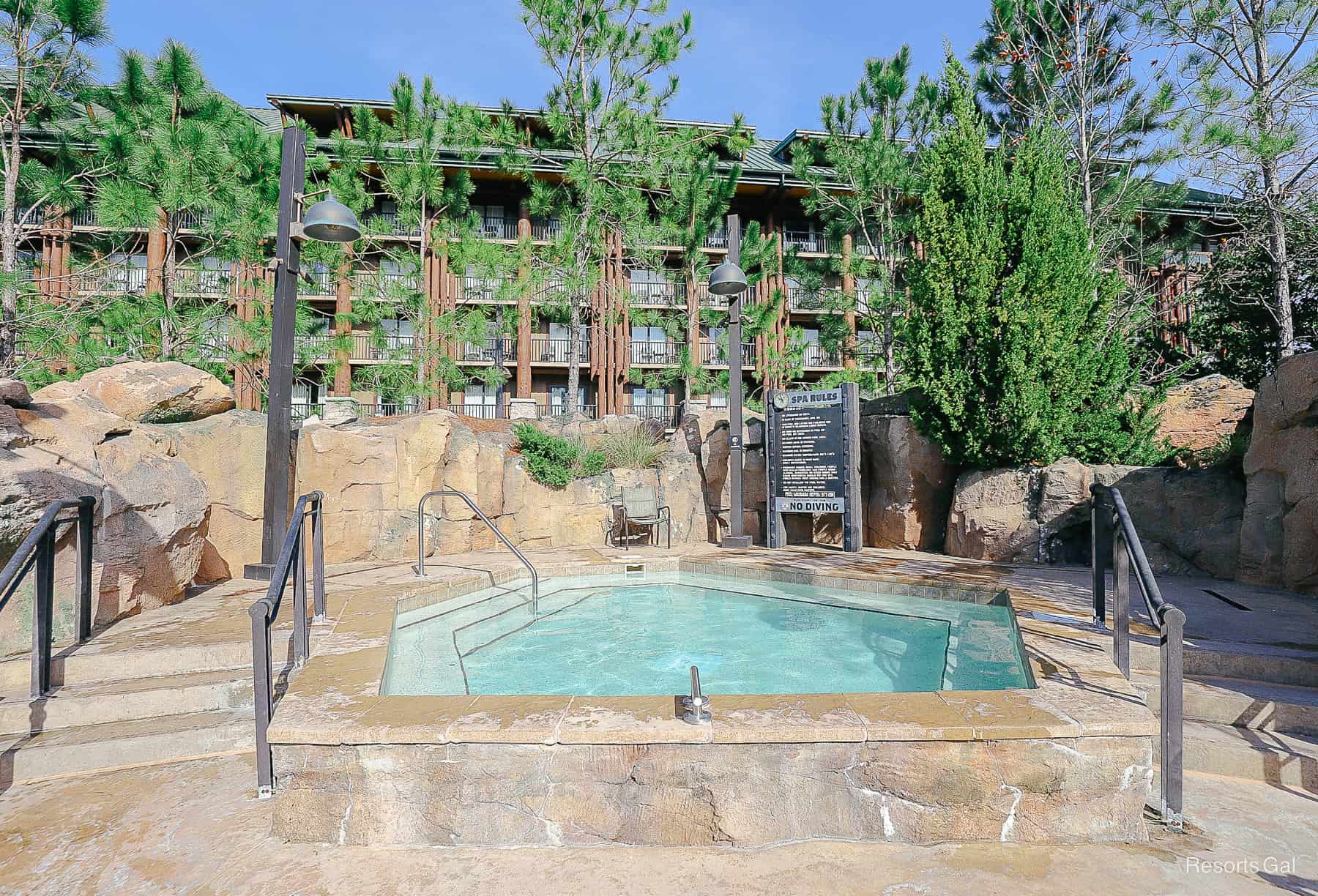 a hot tub with the Copper Creek Villas behind it 