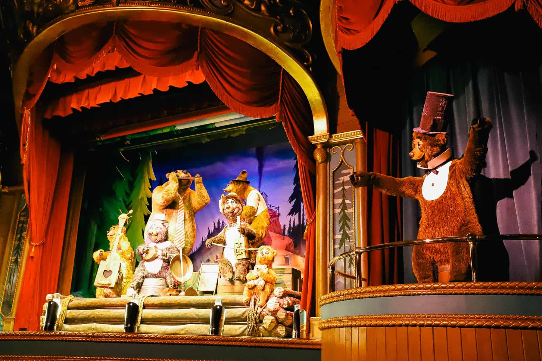 Five Bear Rugs band signs on the stage of the Country Bear Jamboree. 