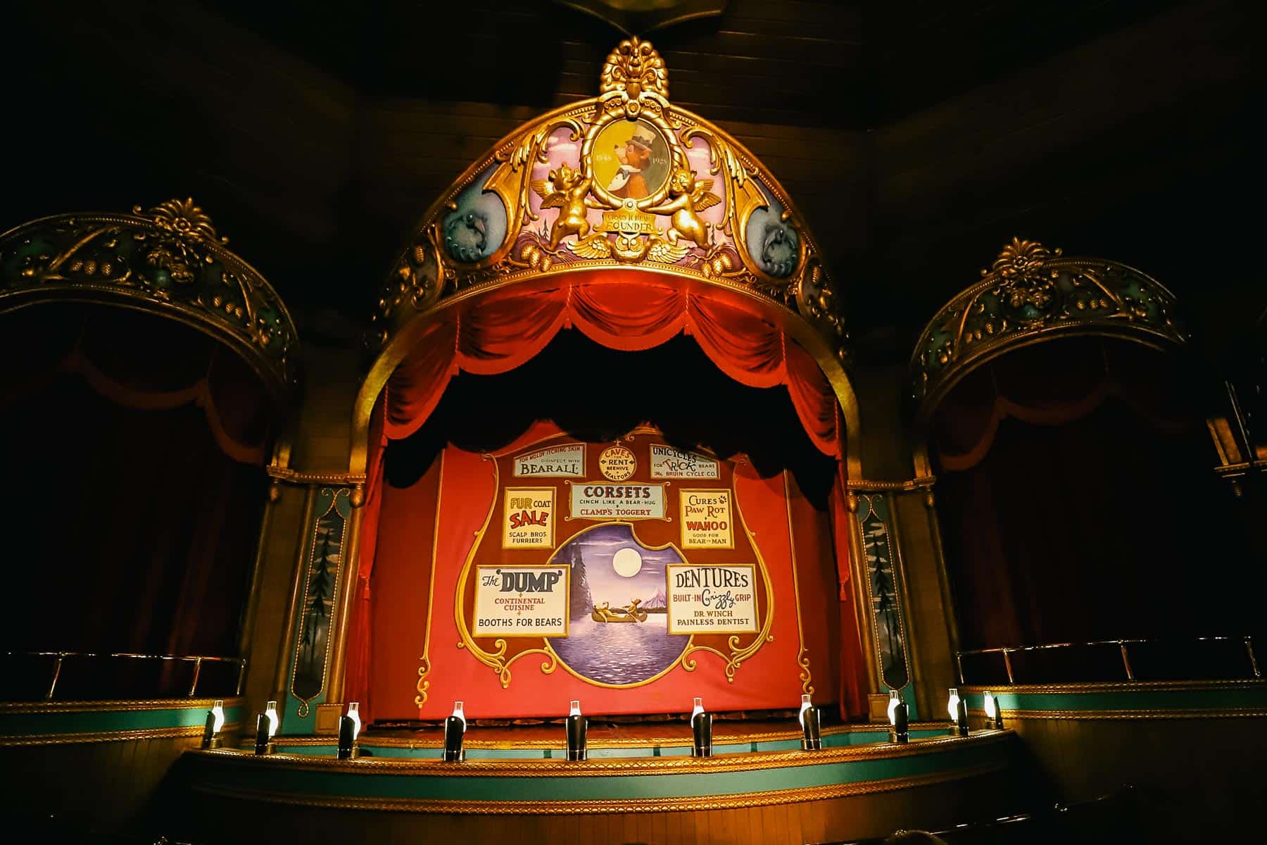 The stage of the Country Bear Jamboree with posters advertising the acts.