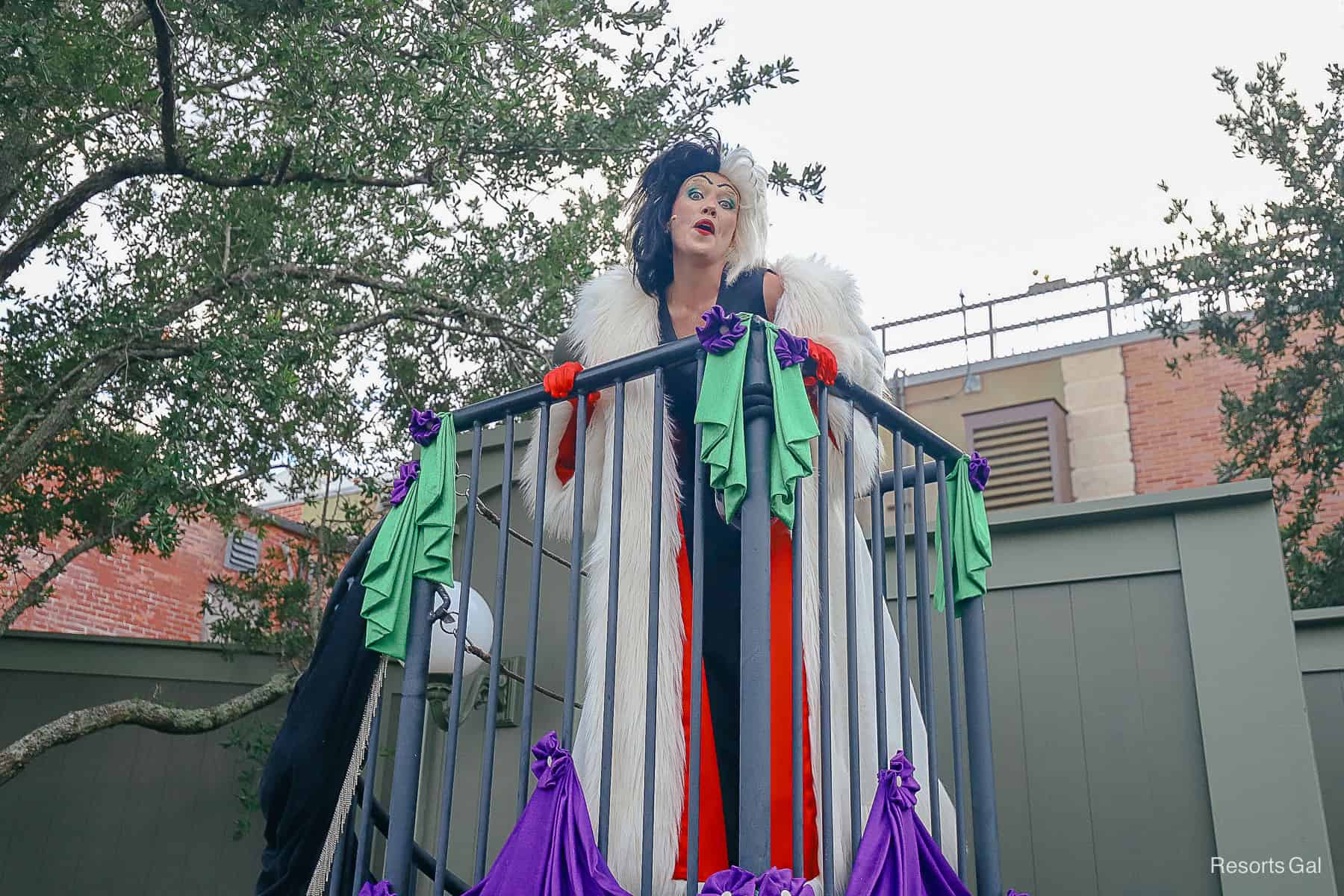 Cruella poses for a frightful photo at the party's entrance. 