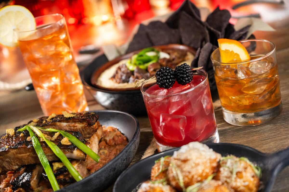 a spread of new menu items coming to the Diamond Horseshoe at Magic Kingdom