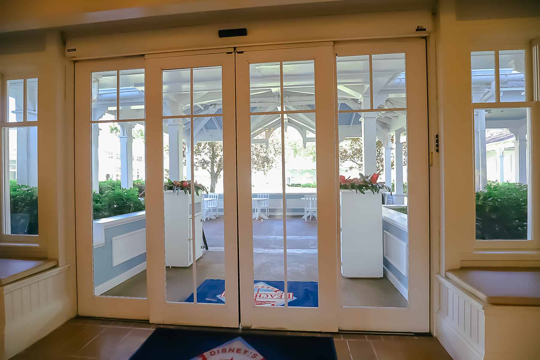 double doors across from the entrance of Beach Club Marketplace 
