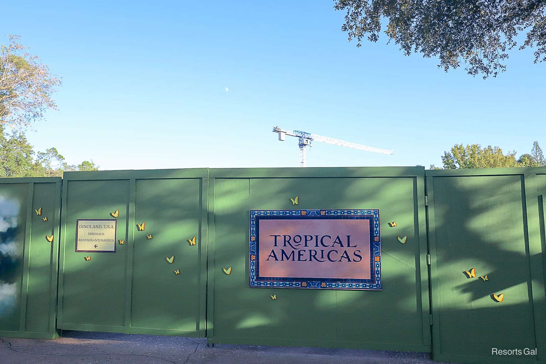 a construction wall in Dinoland, U.S.A. that has the Tropical Americas logo. 