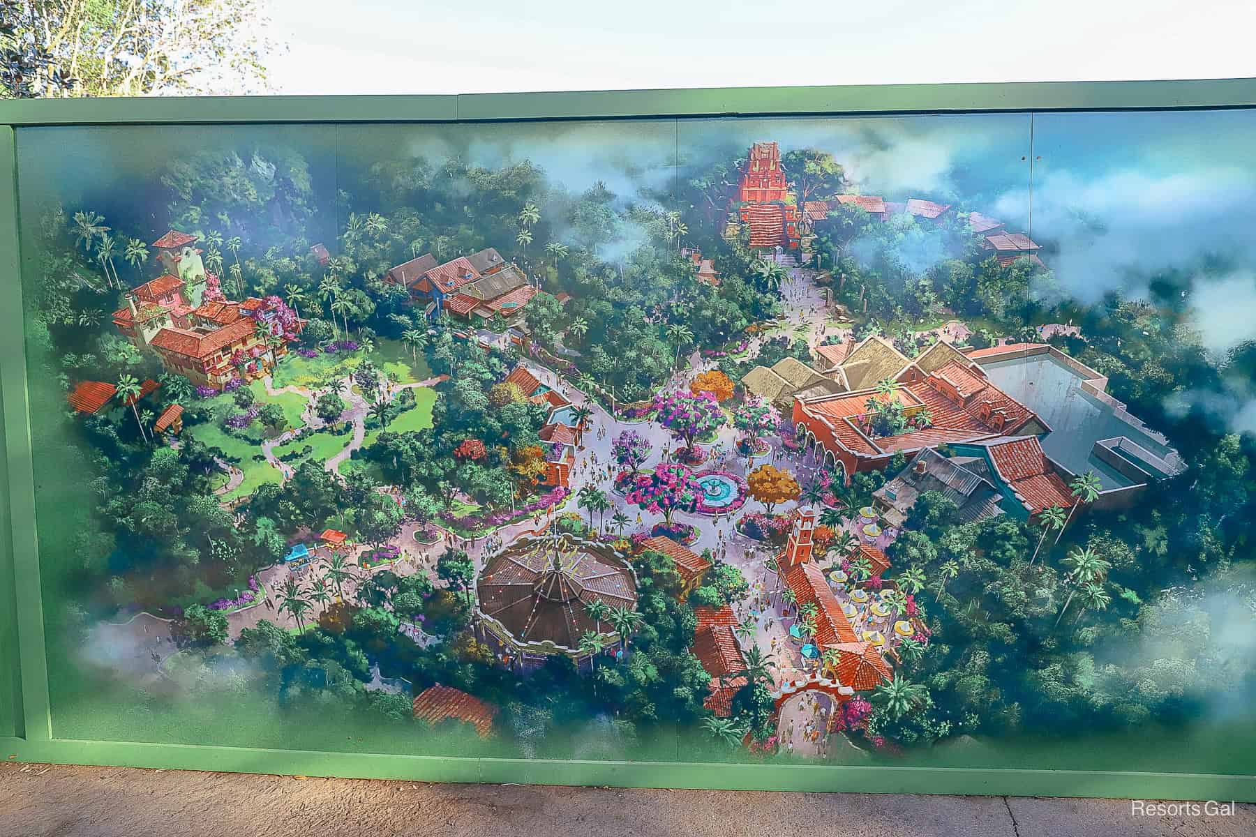 a construction wall with Concept Art of Pueblo Esperanza on the Dinoland Construction wall