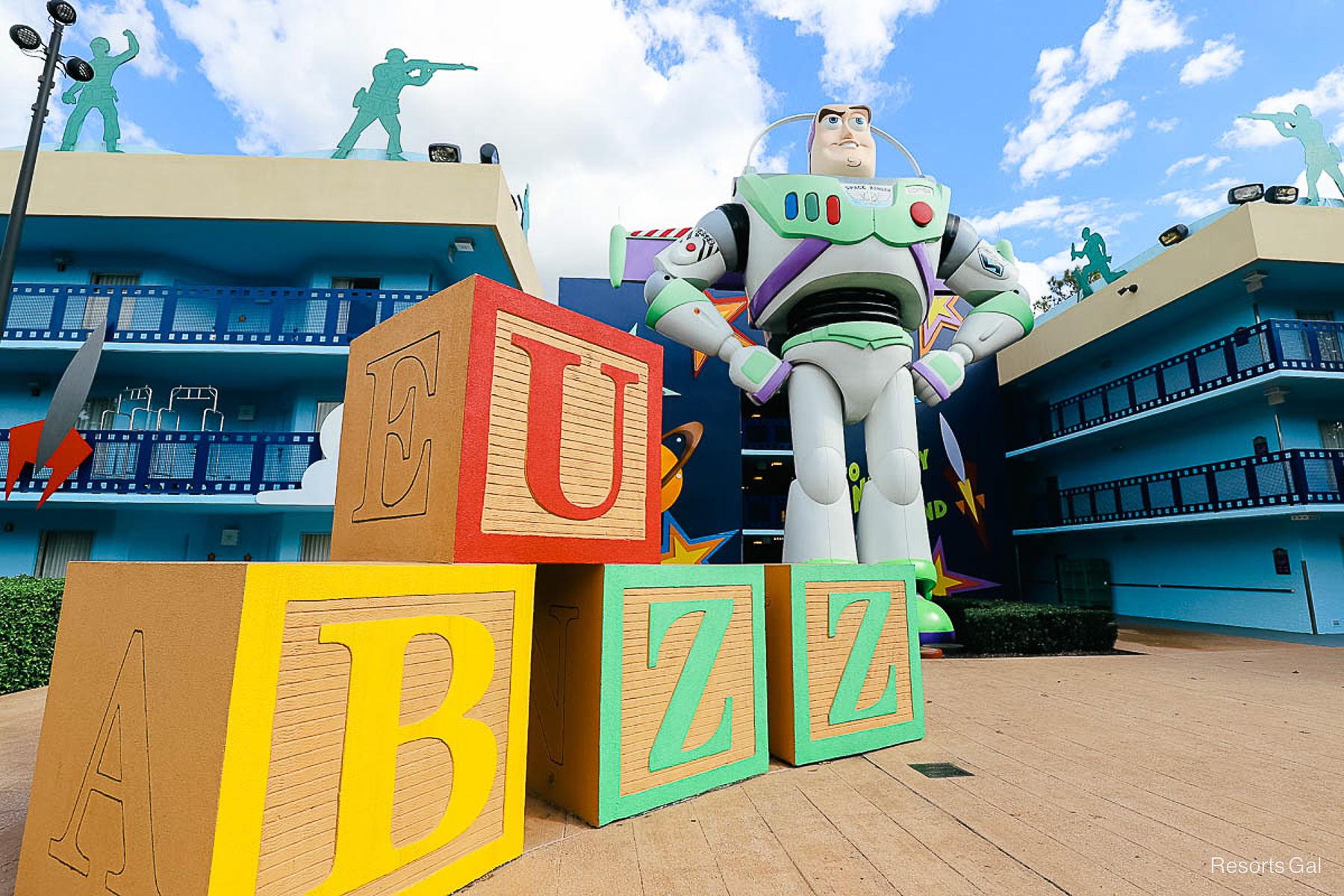 Buzz Light year with giant blocks beside him that spell out Buzz 