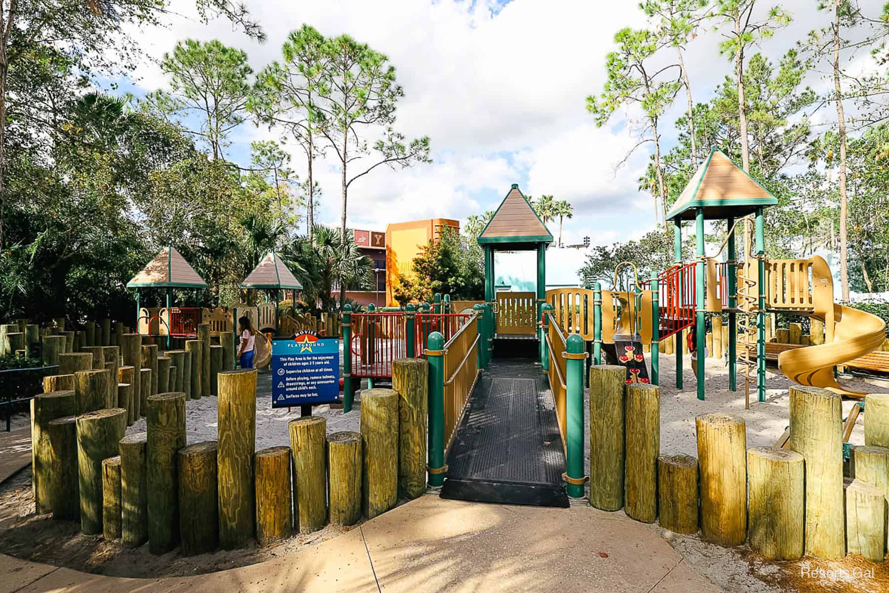 a playground that's brown with red and green accents 