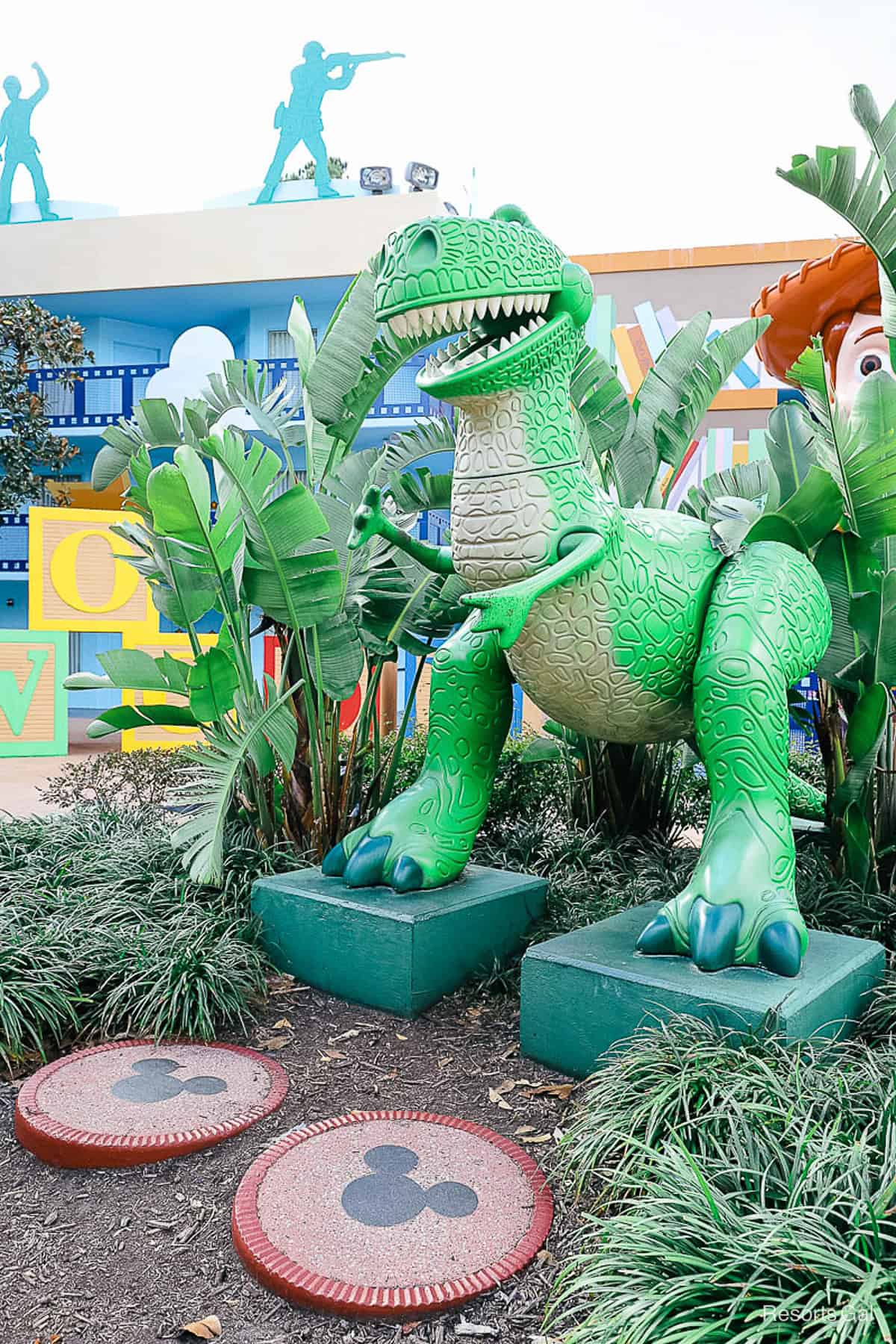 Rex surrounded by large green leaves 