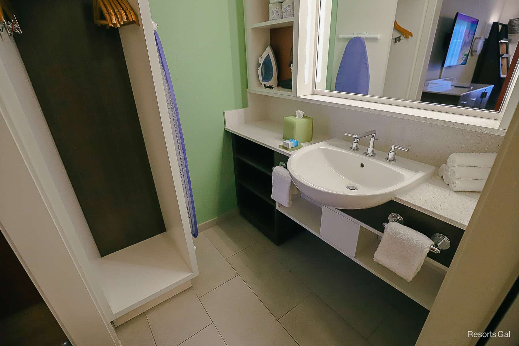 the vanity area in the bathroom with one sink