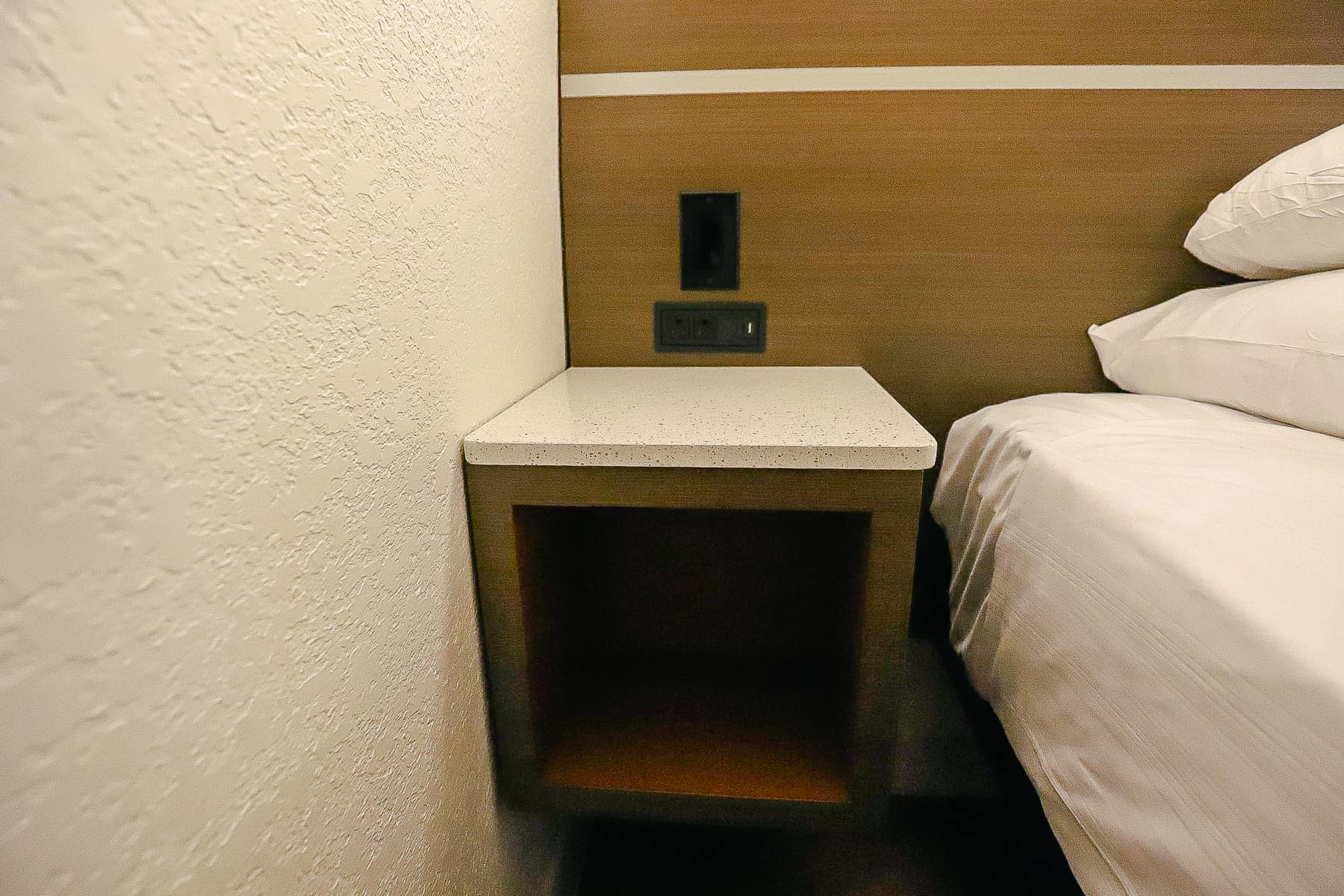 a cubby hole that serves as a nightstand 