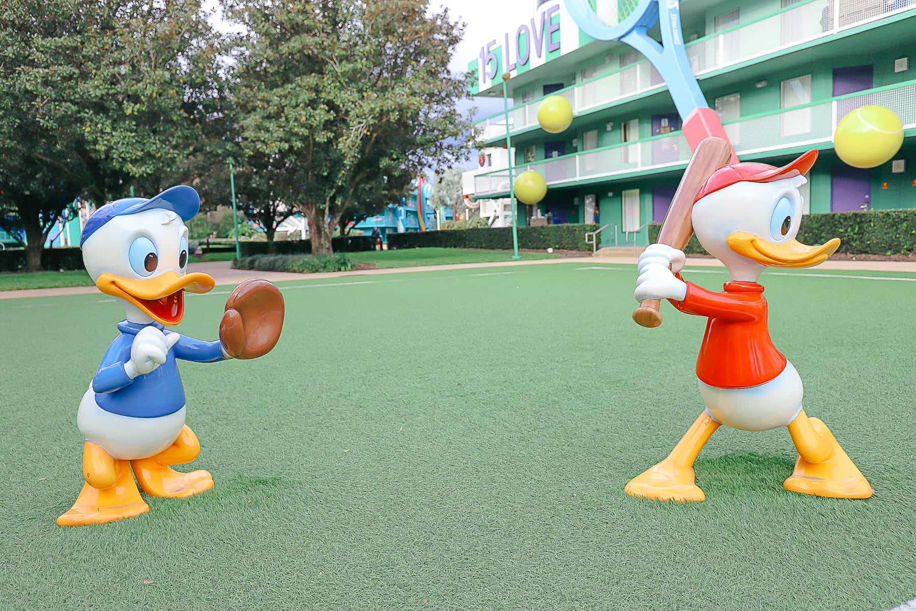 Donald's nephews playing baseball on the tennis court at All-Star Sports.