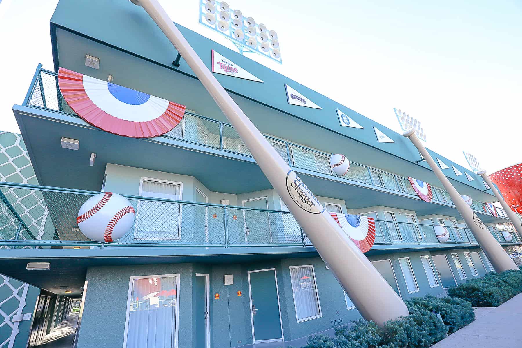 baseball bats and balls on the exterior balcony of the Home Run Hotel 