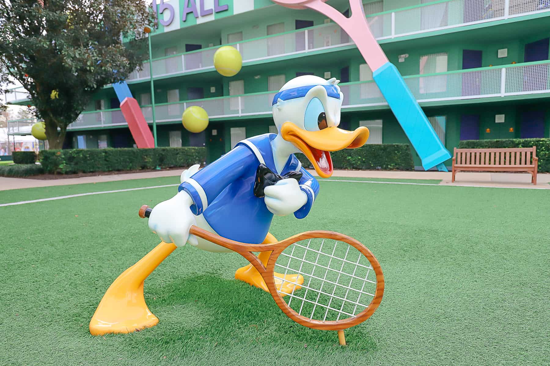 Donald Duck on center court with a tennis racket at All-Star Sports 