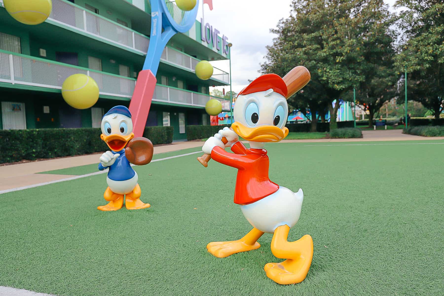 Donald's nephews playing baseball on the tennis courtyard at All-Star Sports