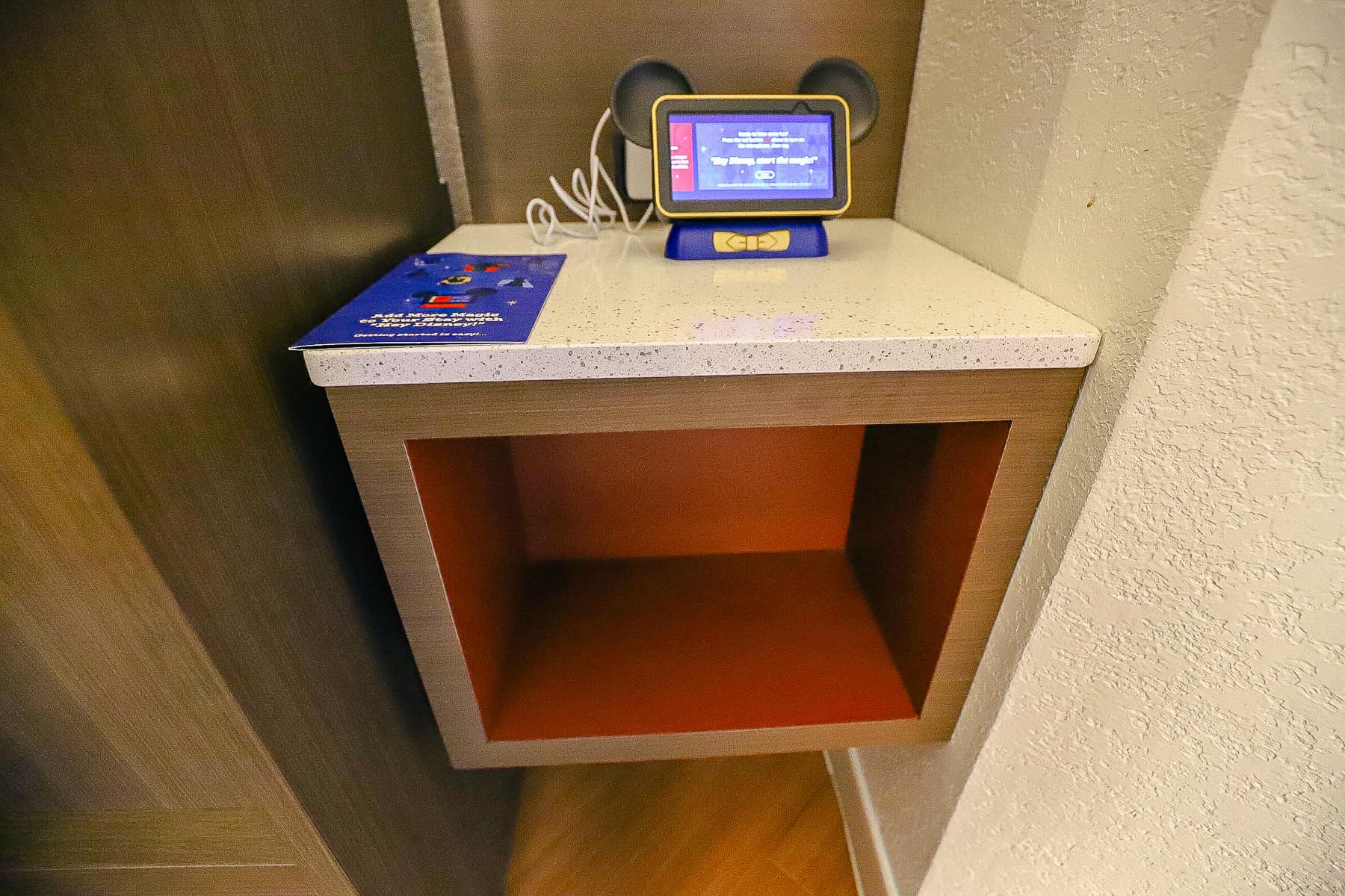 cubby-hole and night stand on the opposite side of the table bed 