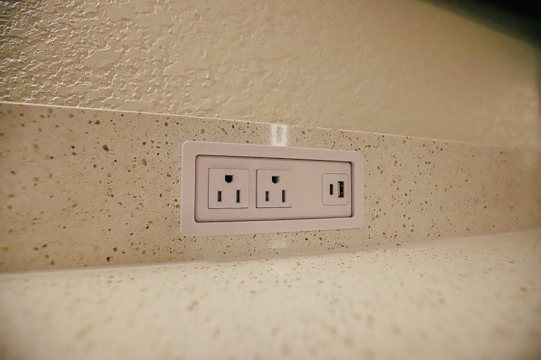 two sets of outlets and USB ports on top of the dresser 