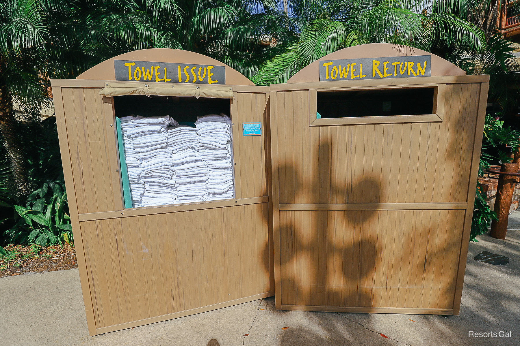 a towel bin with clean fresh towels next to a towel return bin for used towels 