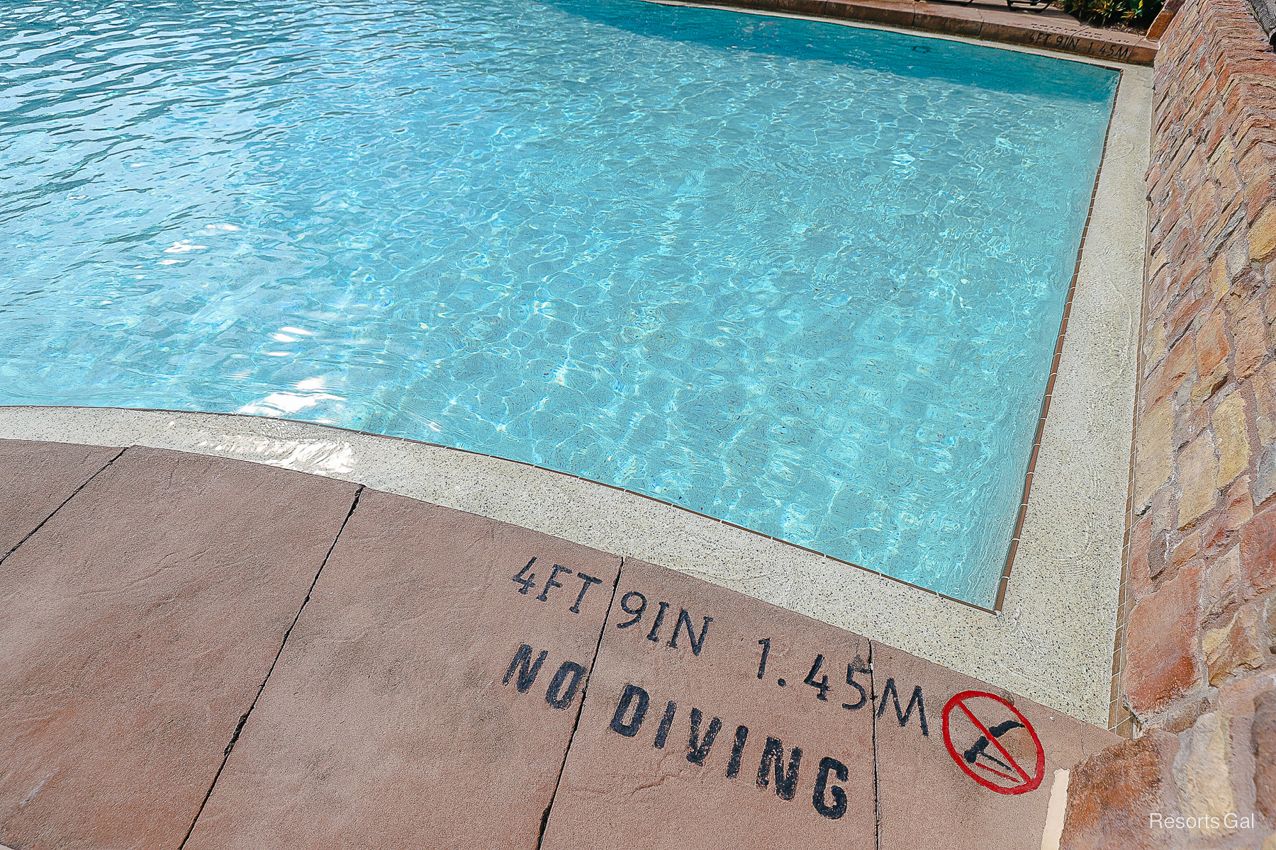 the pool depth is printed on the concrete and it says no diving 