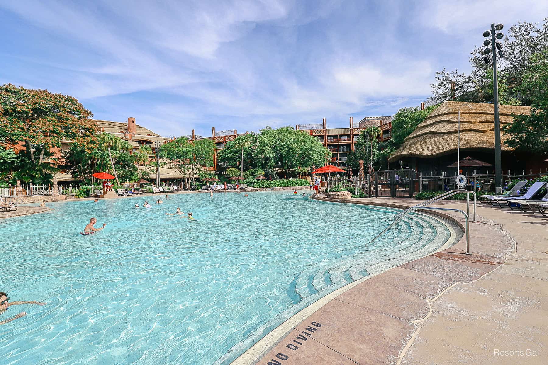 steps on the right side of the pool near the pool bar 