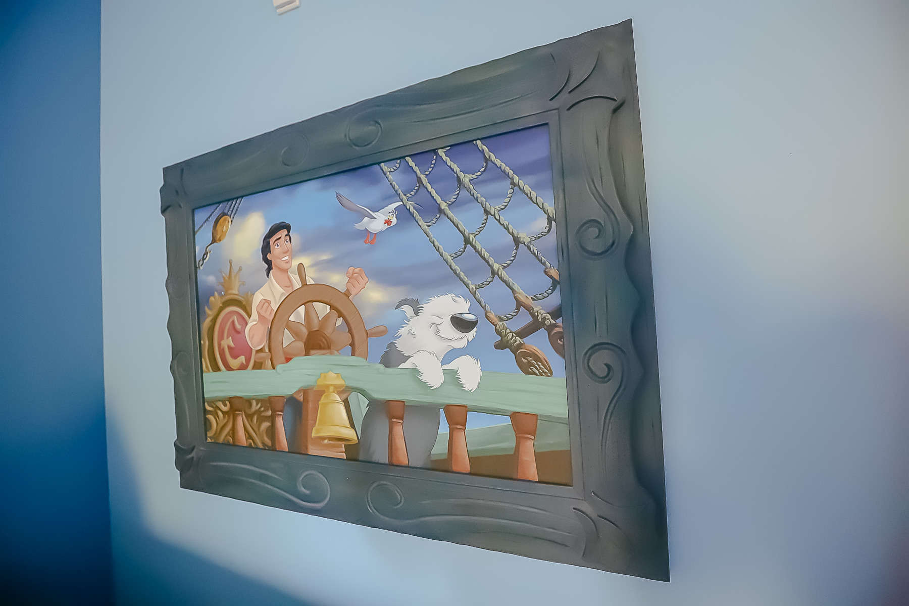 Artwork featuring Prince Eric and Max in the rooms at Disney's Art of Animation. 