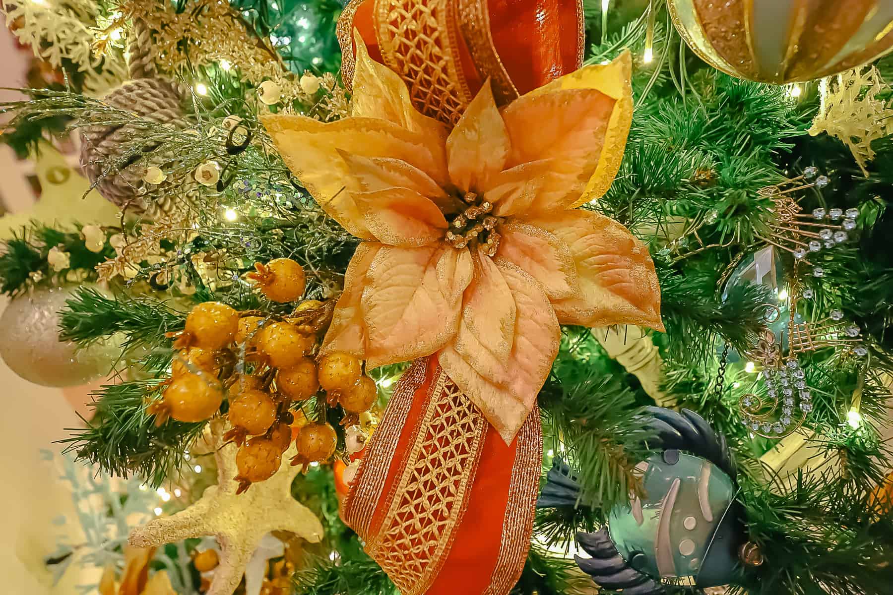 a silk copper flower on the Christmas tree 