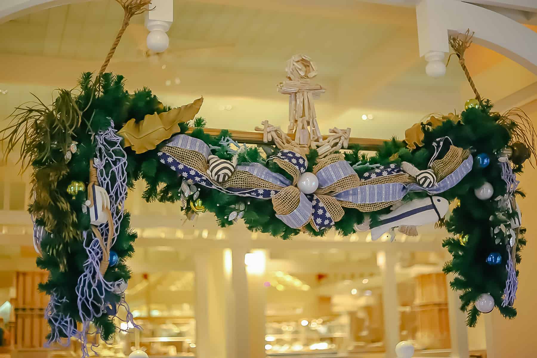 boughs of garland with blue ribbons and anchors 