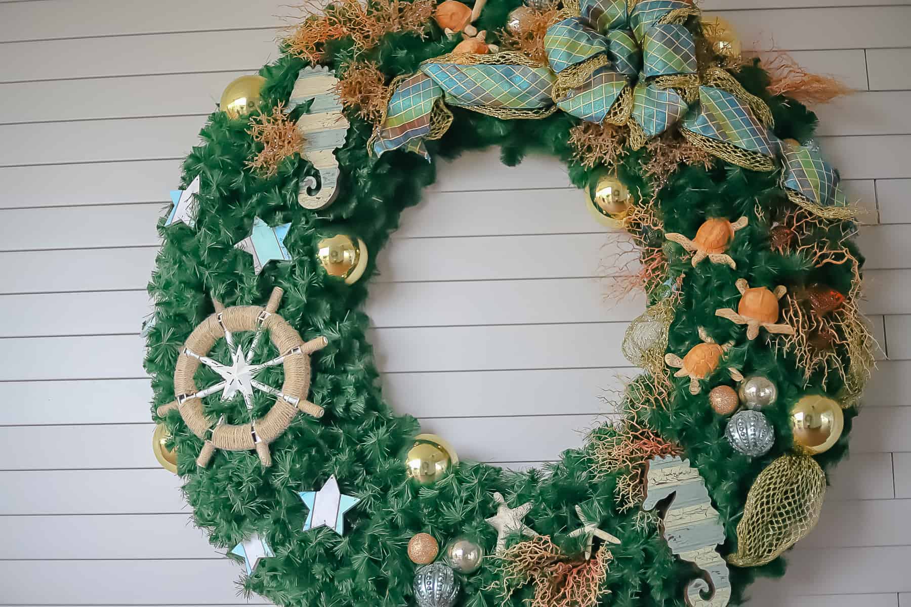 a holiday wreath with seaside decorations 