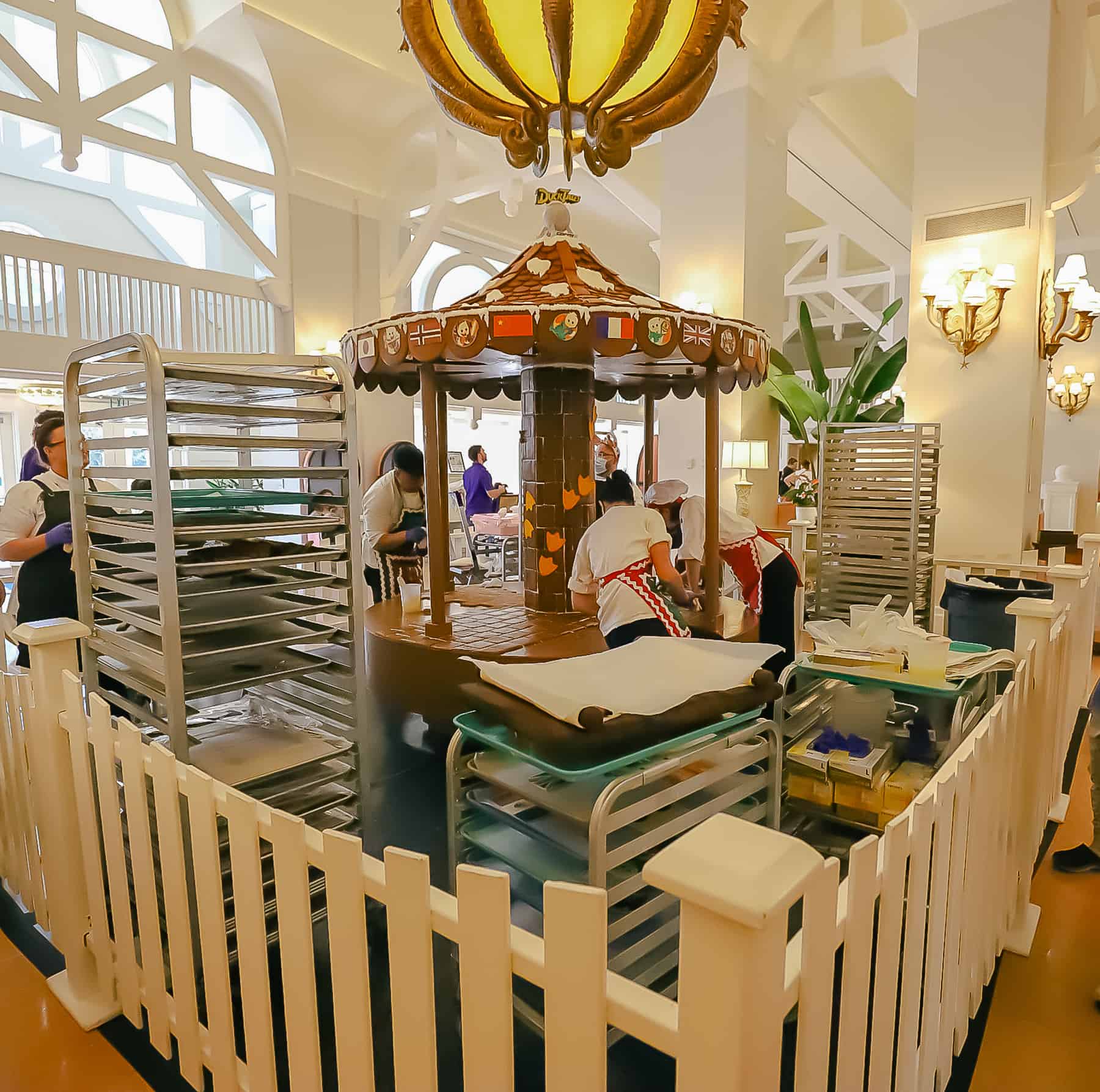 Chefs working to assemble the gingerbread carousel. 