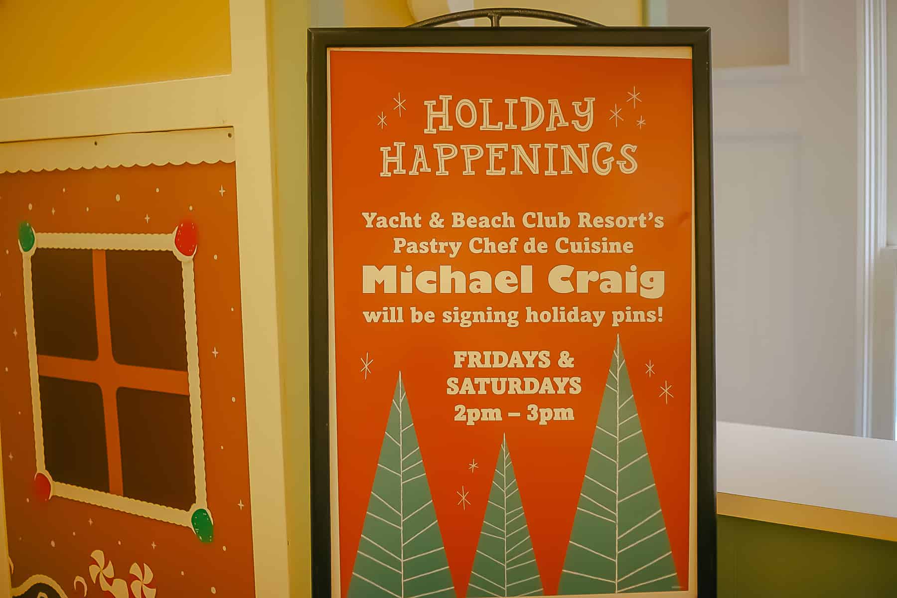 A sign that tells when guests can meet the pastry chef who designed Beach Club's gingerbread carousel.