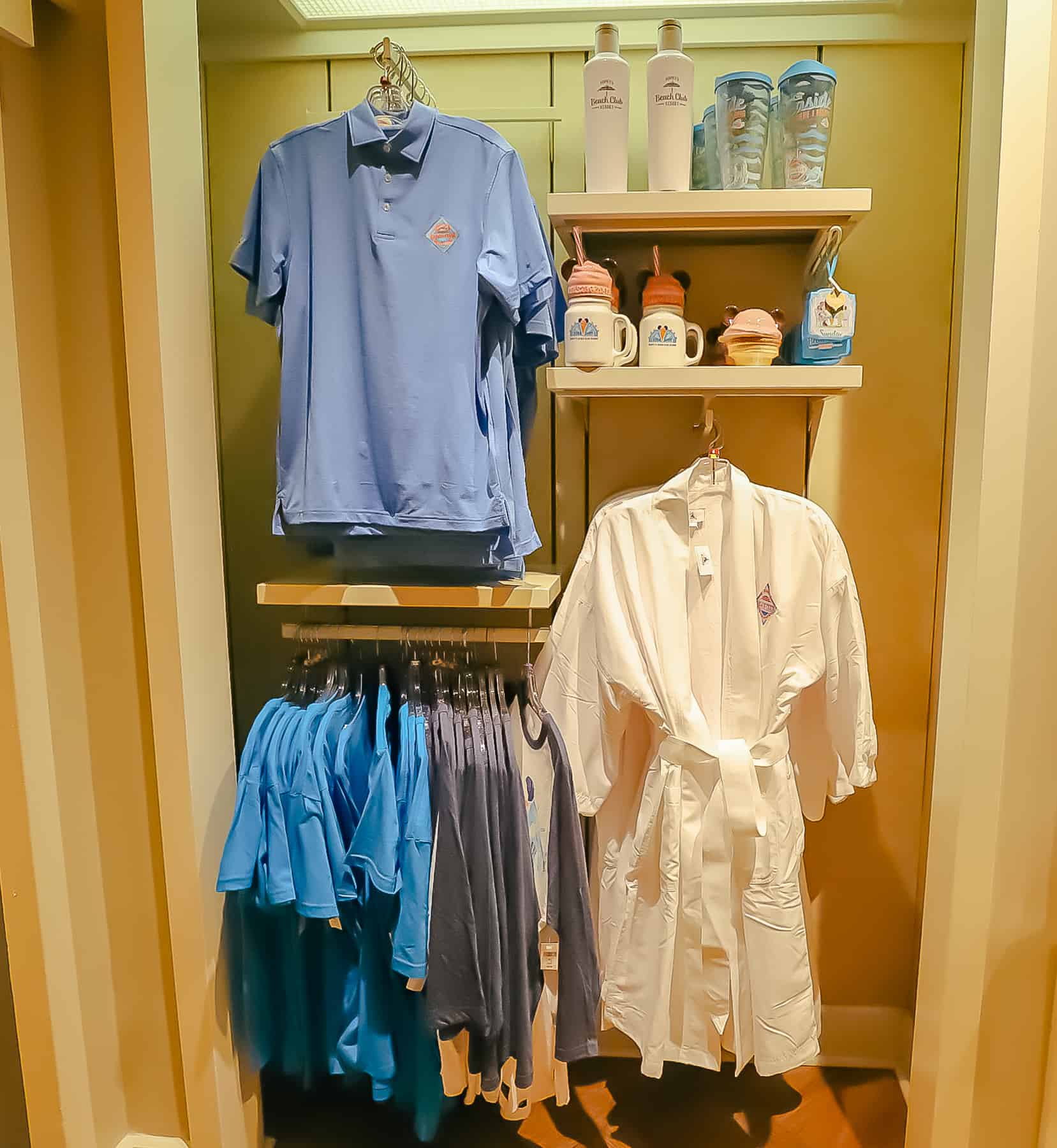 Beach Club merchandise includes a robe, polo shirt, mugs, tumblers, and other items with the Beach Club's logl. 