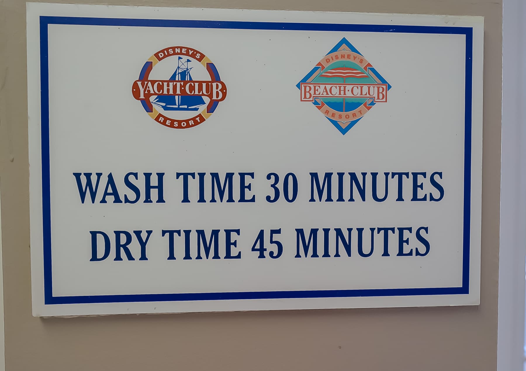 A sign that indicates the wash time is 30 minutes and the dry time is 45 minutes.