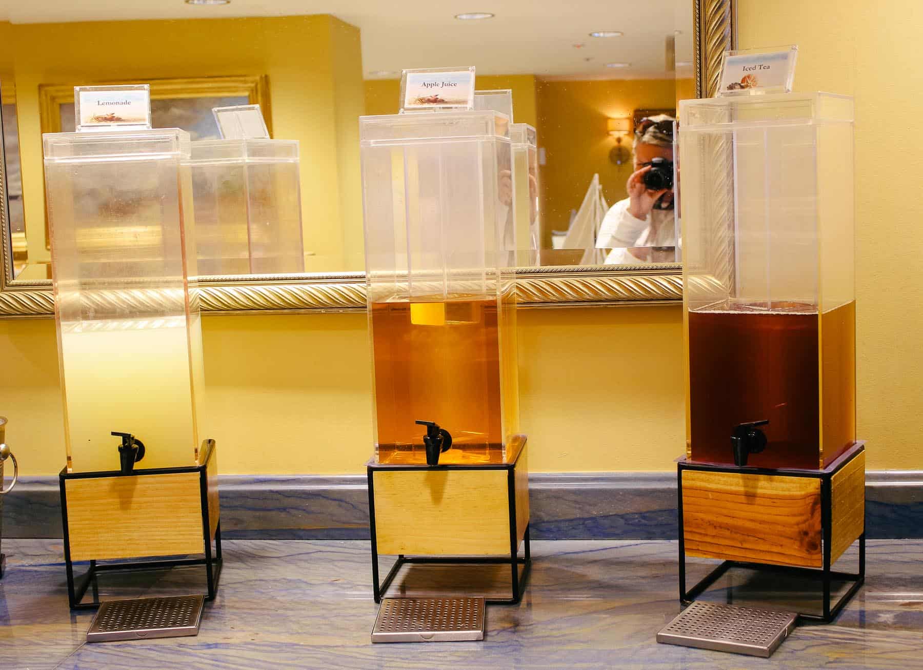 three canisters with juice served in the Beach Club Level (Lemonade, Apple Juice, and Tea)