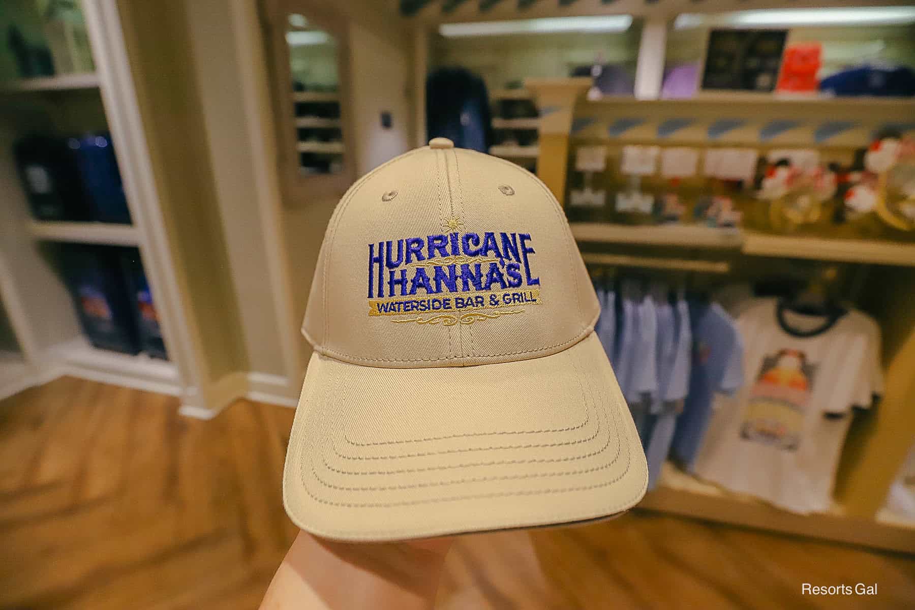 a tan hat with the Hurricane Hanna's Logo 