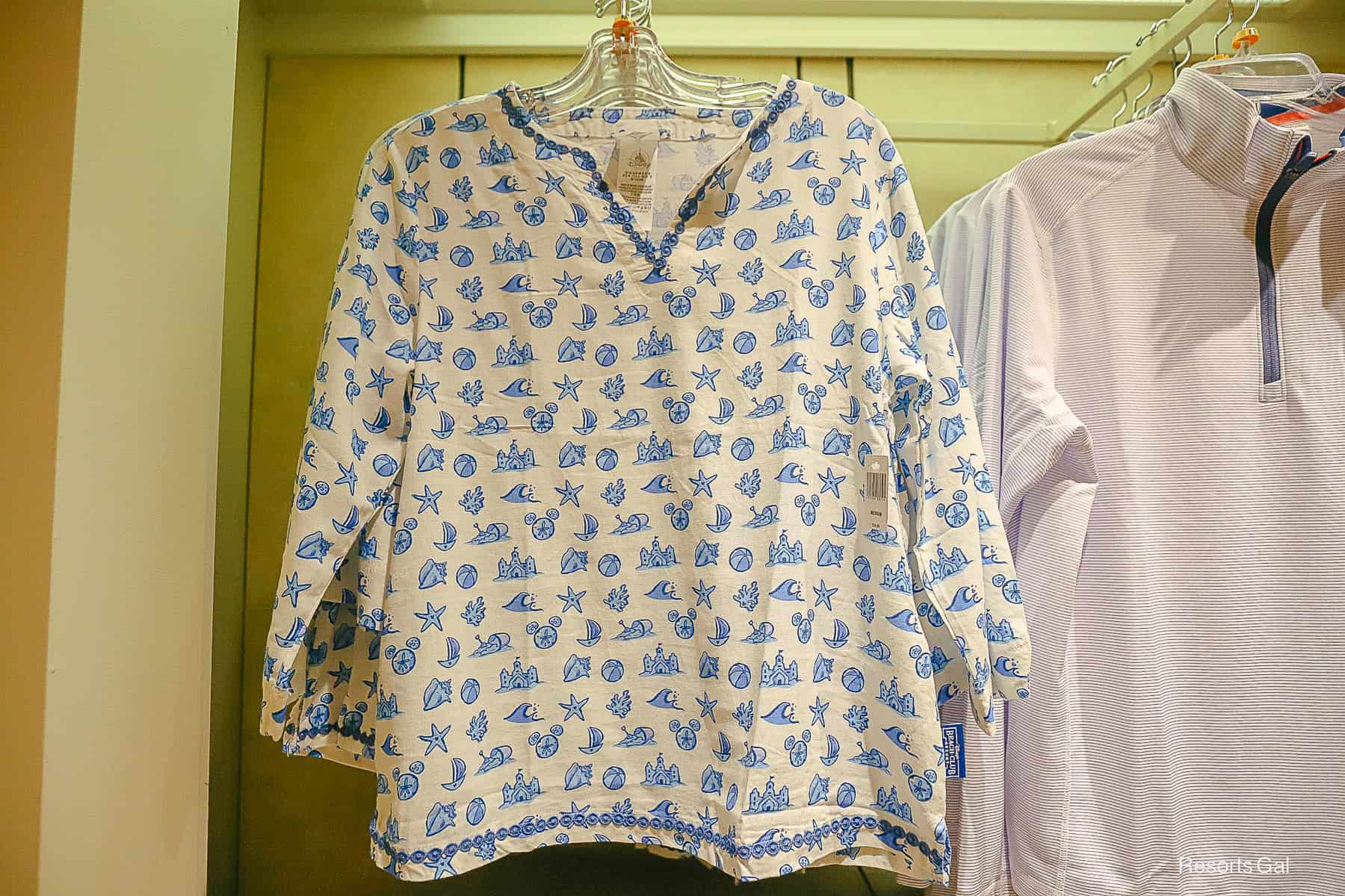 a linen shirt with a an all-over beach print representing Disney's Beach Club Resort 