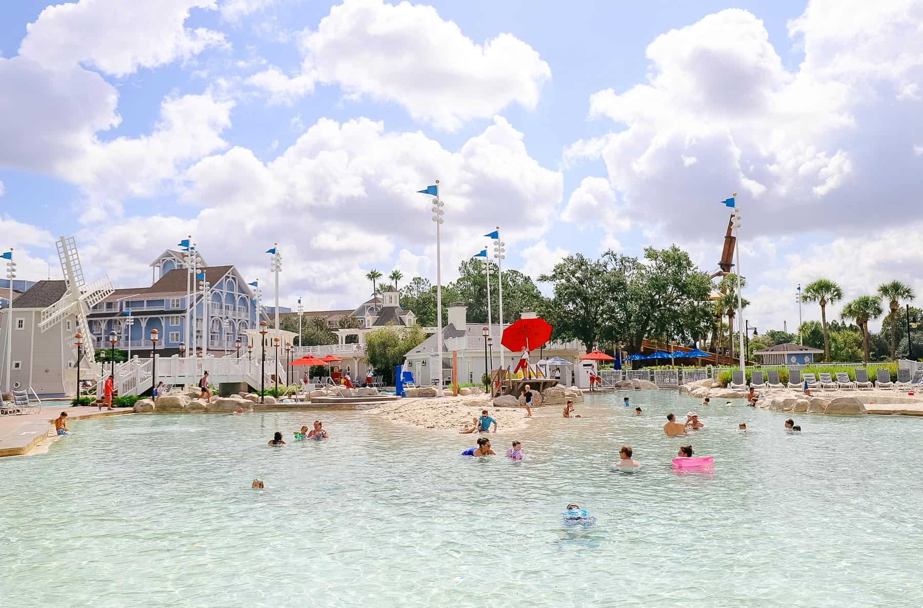 A pool area with children playing in the sand at Disney's Beach Club. 