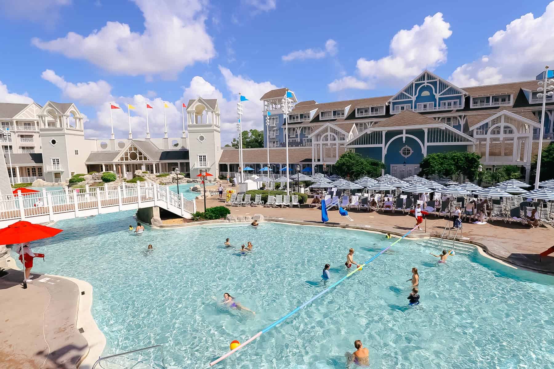 Guests playing volleyball in the pool at Disney's Beach Club. 