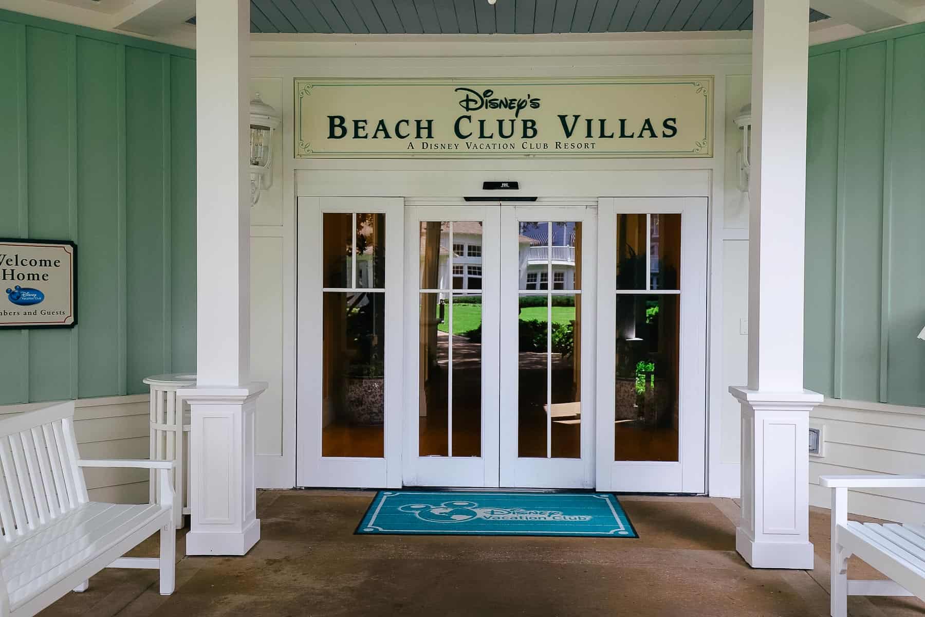 A sign that says Beach Club Villas over the entrance of the villas wing. 
