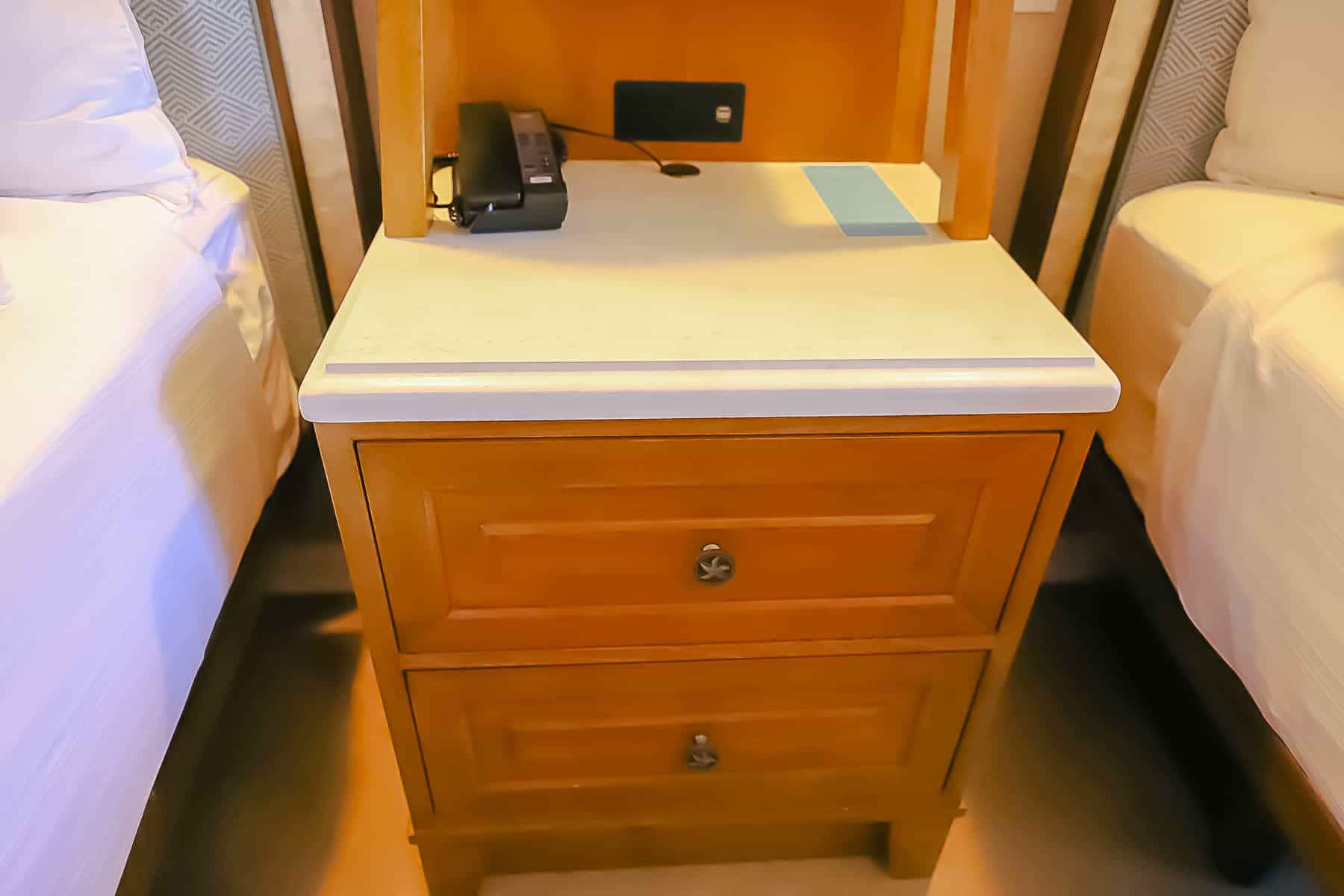 shows outlets at the back of the nightstand 
