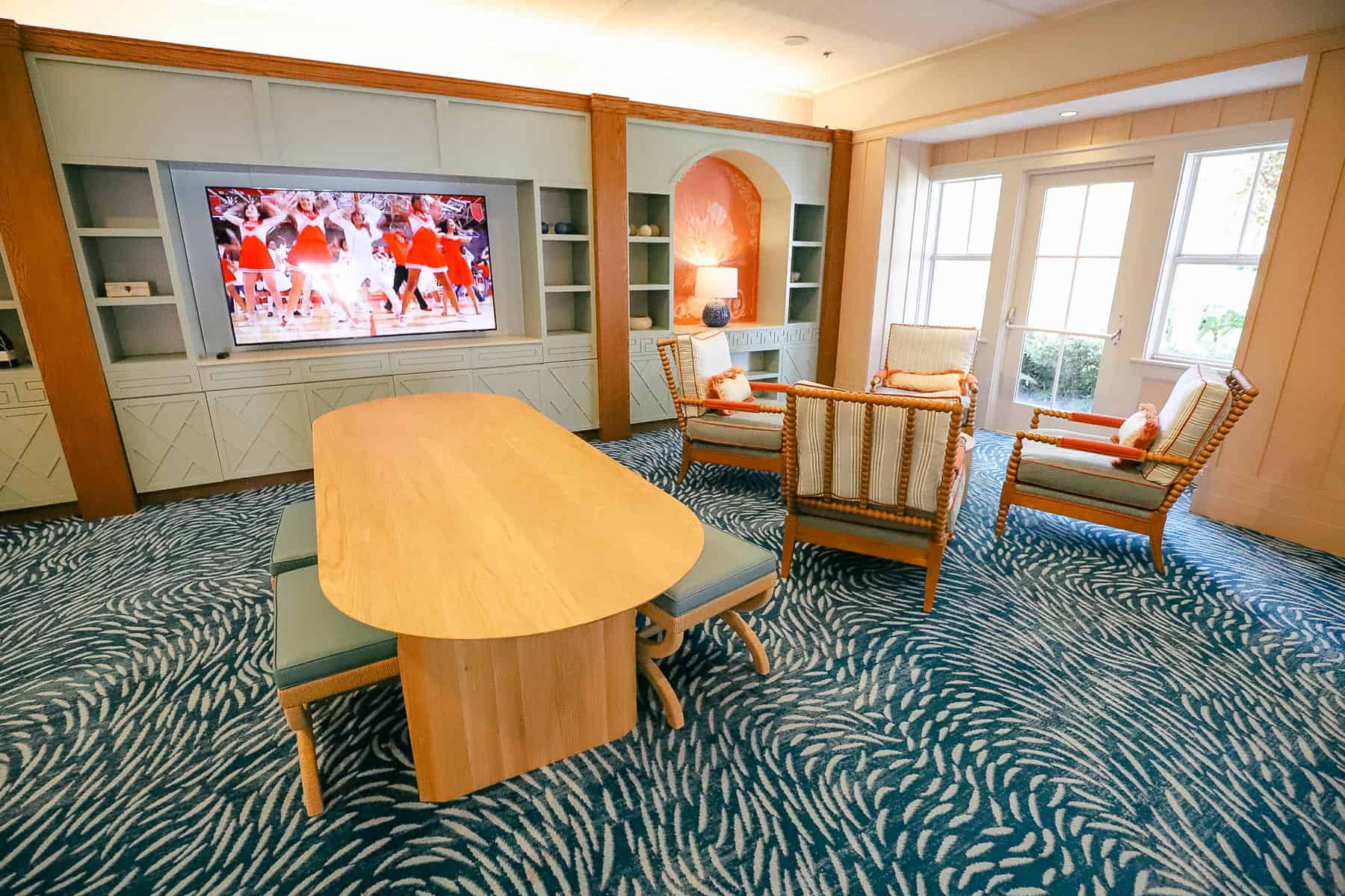 table with small chairs in front of television in Beach Club Villas