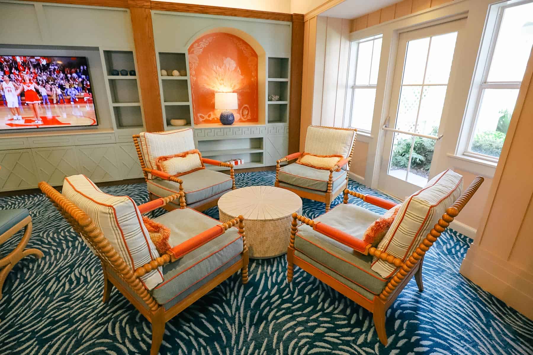 lounge area inside Beach Club Villas with chairs around a table