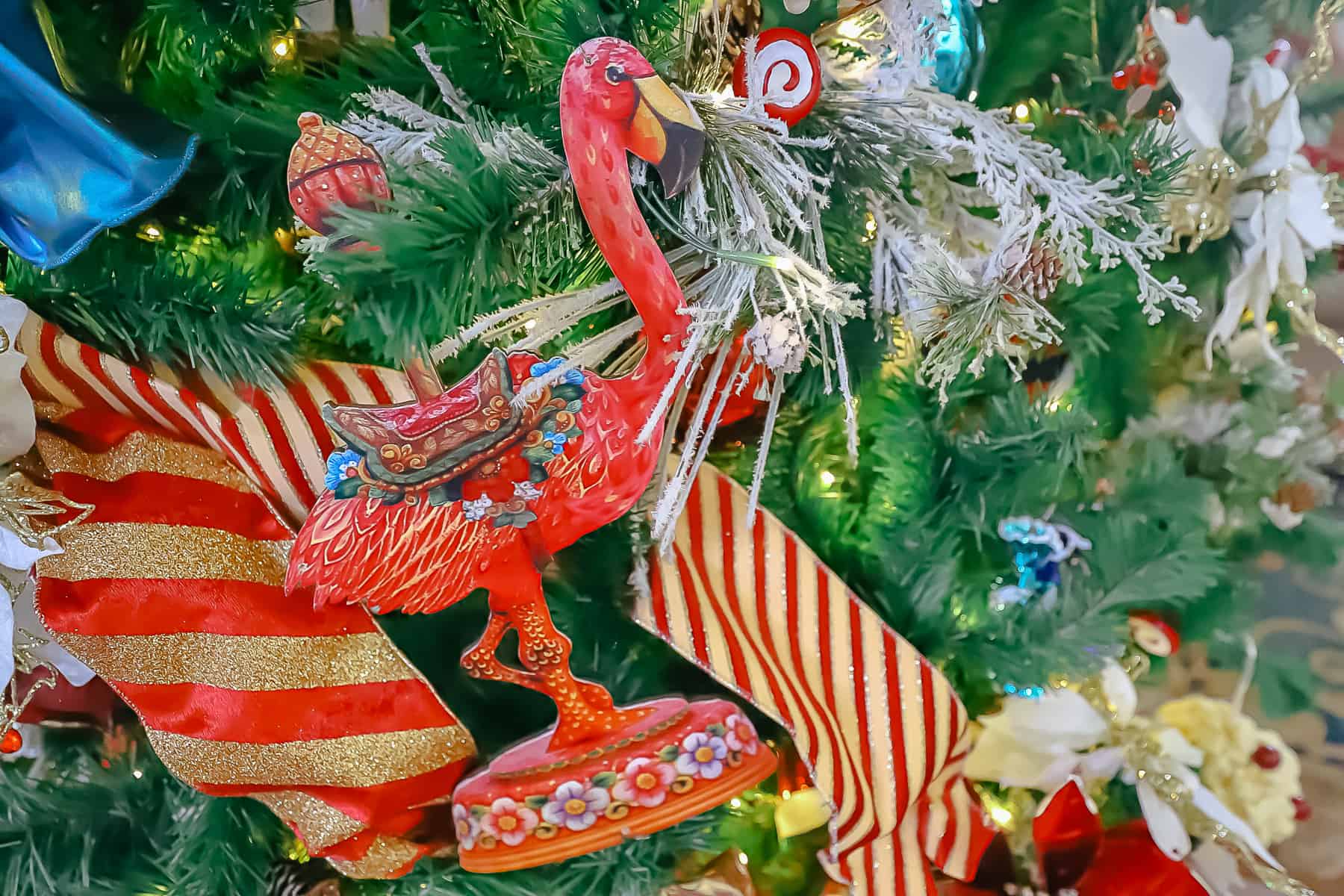 a flamingo carousel ornament on the lobby tree at Disney's Boardwalk 