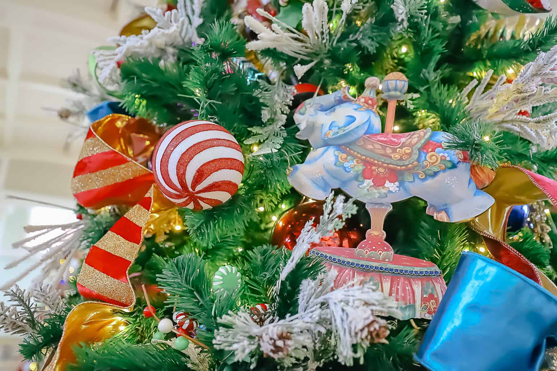 an elephant carousel ornament on the Christmas tree 