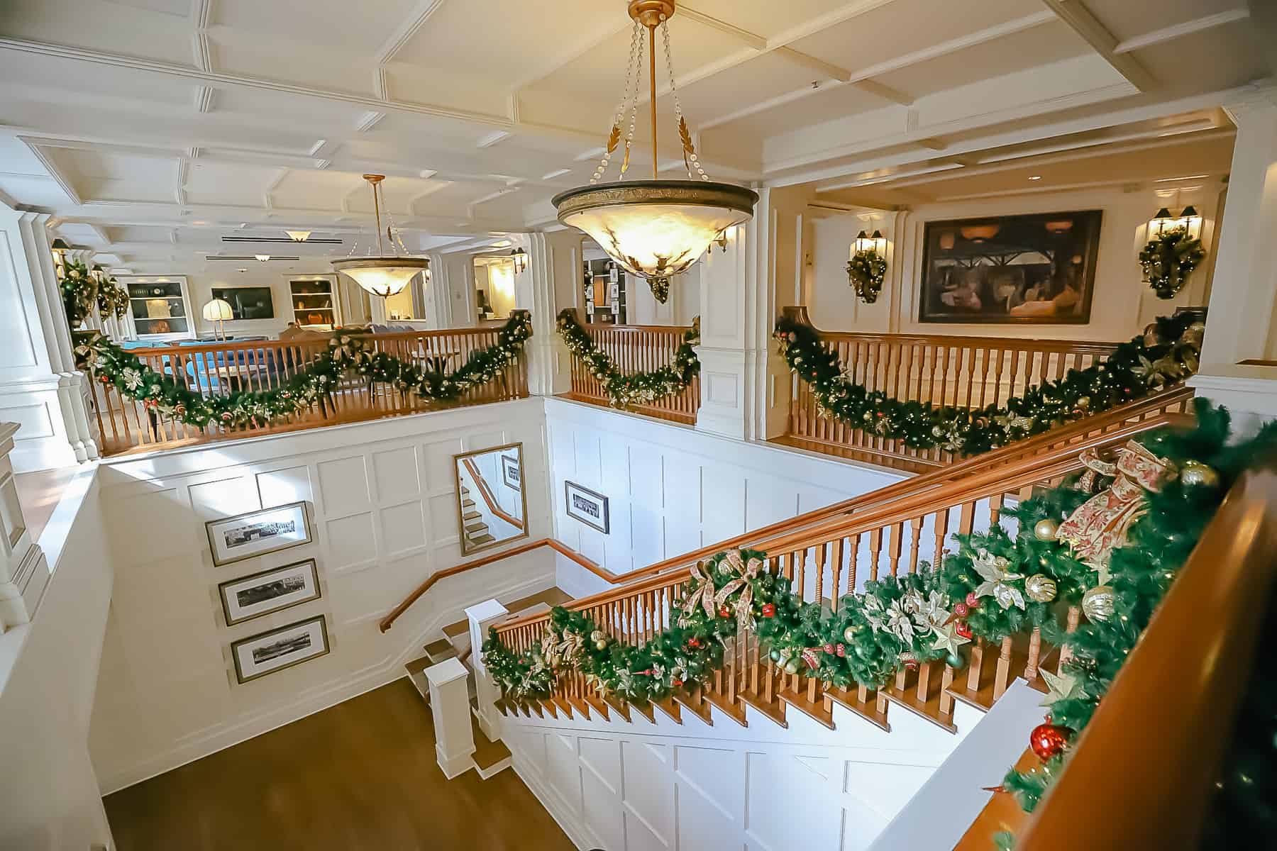 the staircase next to Belle Vue Lounge at Disney's Boardwalk decorated for Christmas 
