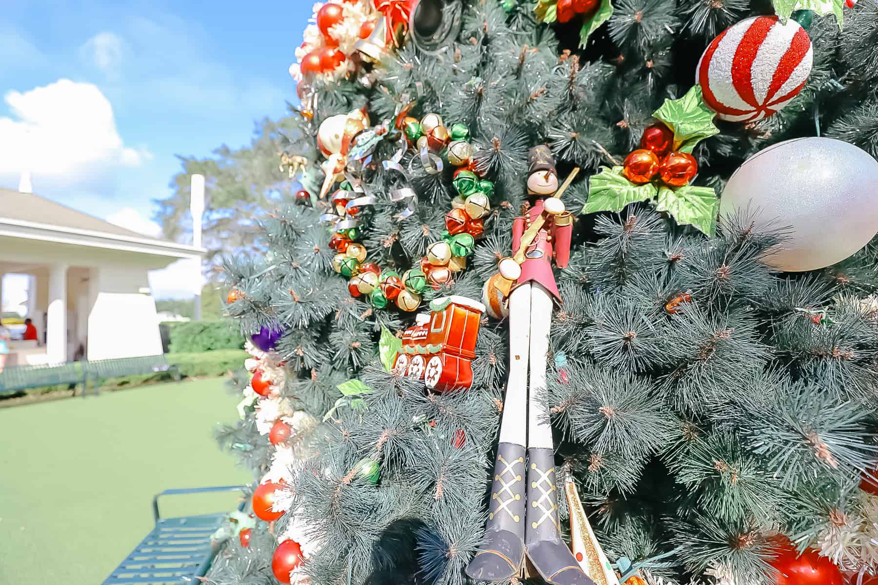a large nutcracker ornament on the tree 