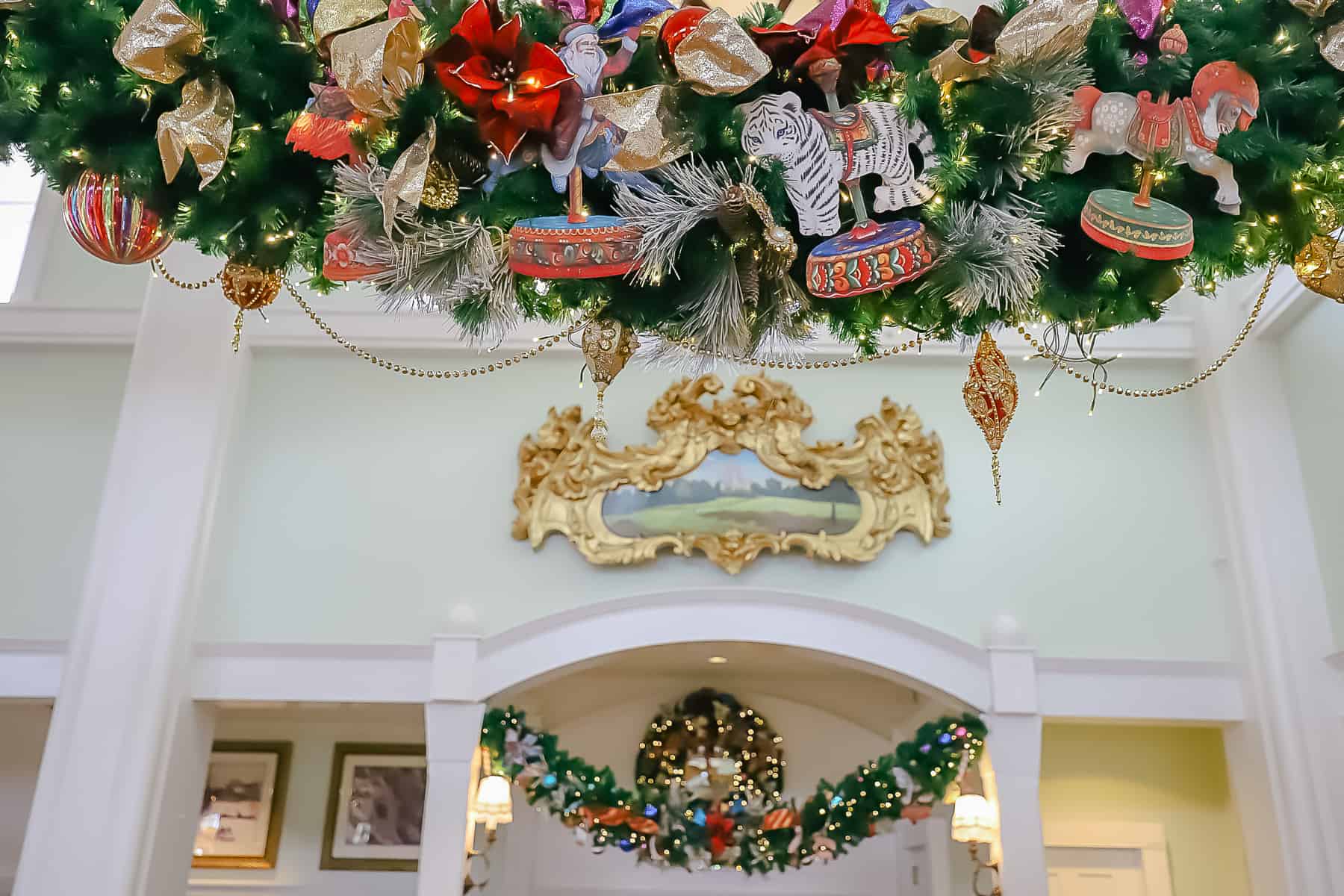 festive garland rows in the lobby of Disney's Boardwalk at Christmas