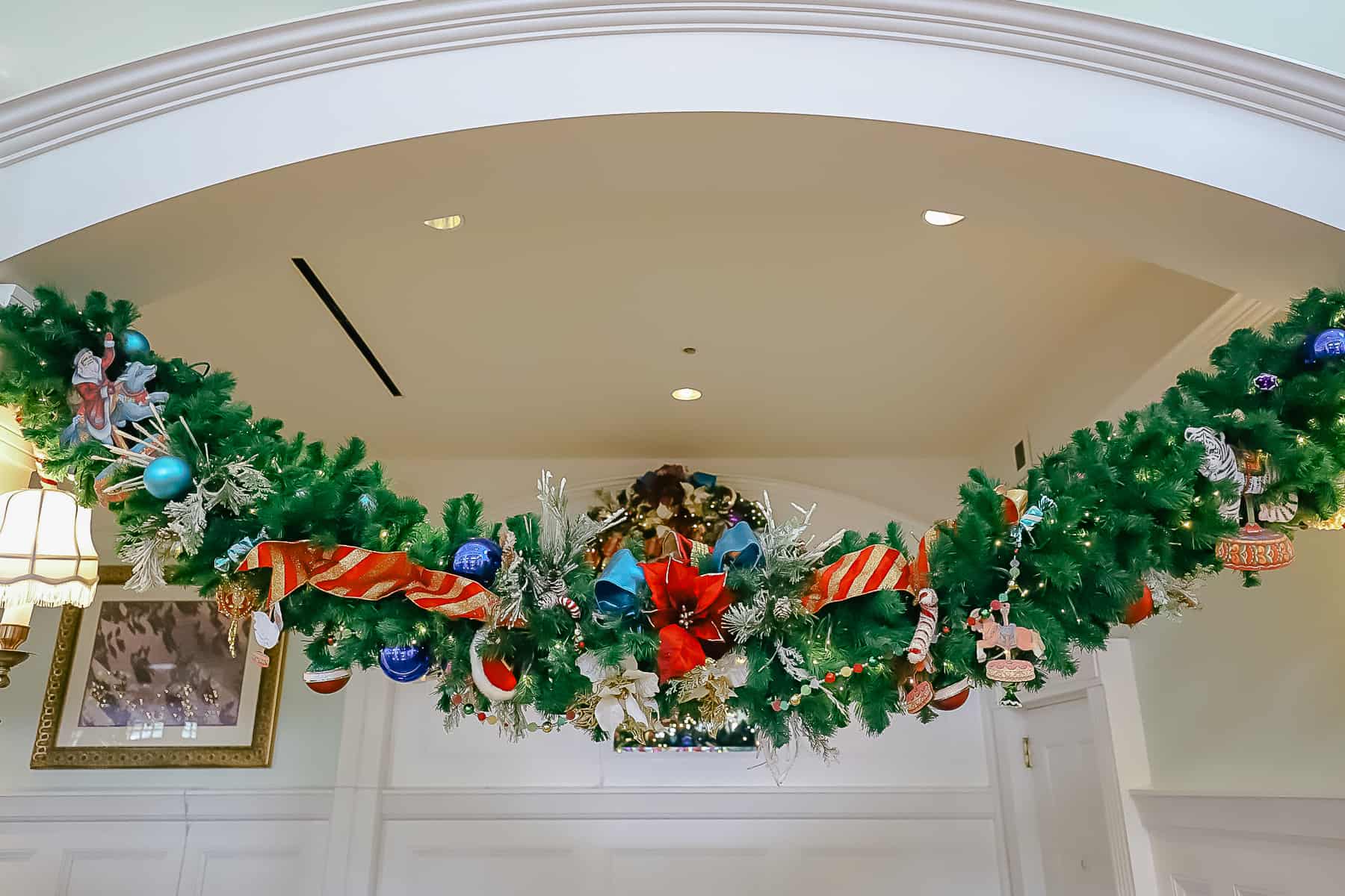 garland centered with bright red poinsettias