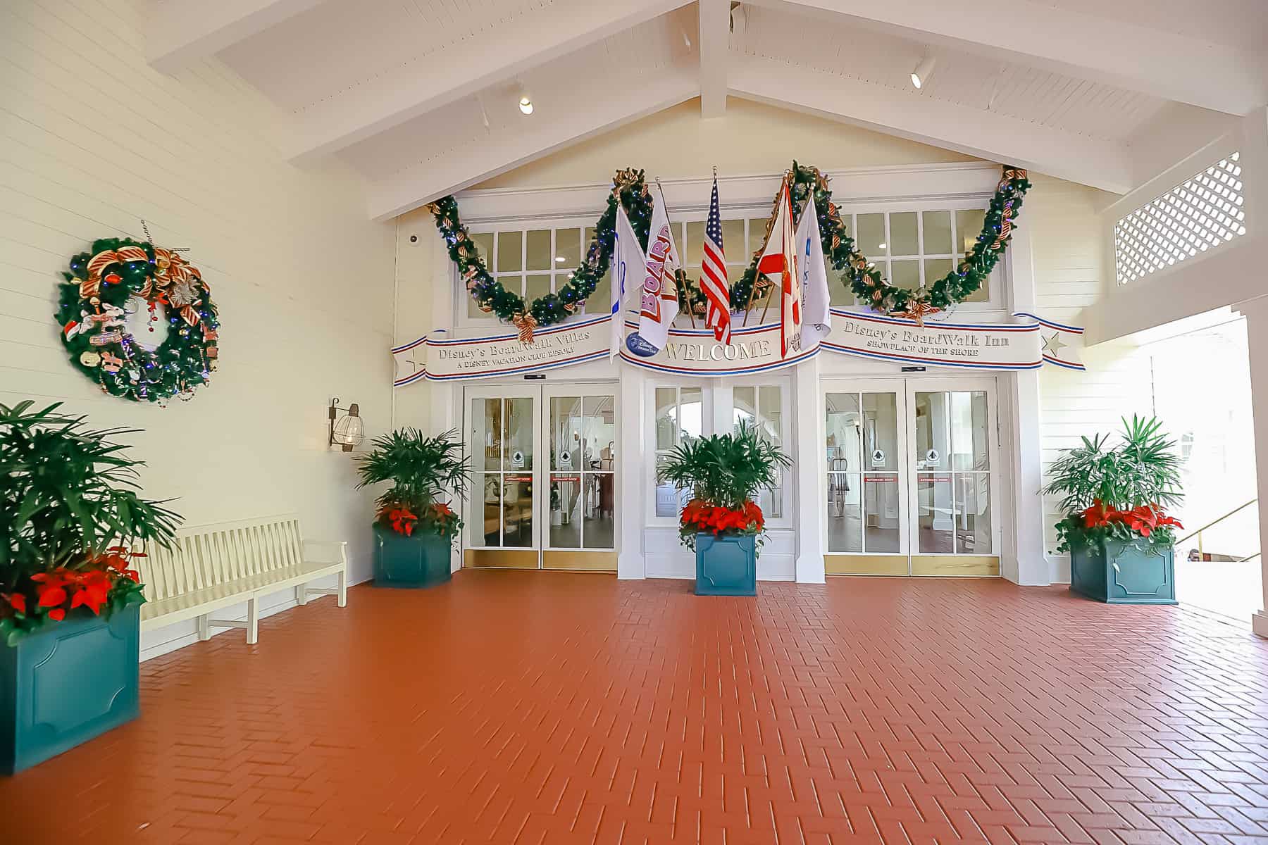 exterior entrance to Disney's Boardwalk Inn dressed in holiday trimmings 